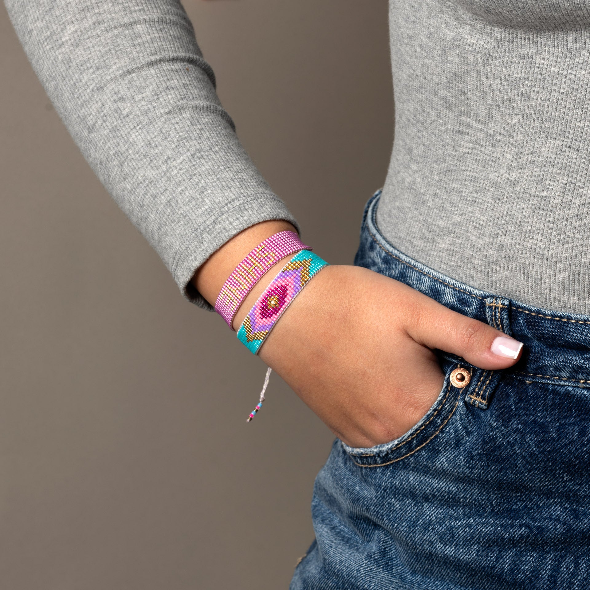 Bracelet beaded, in fuchsia 'evil eye'